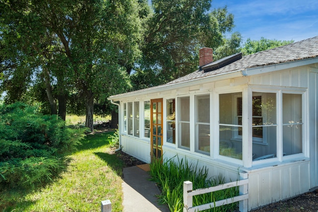 view of side of property with a sunroom