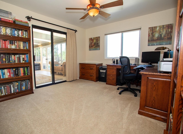 office with ceiling fan and light colored carpet