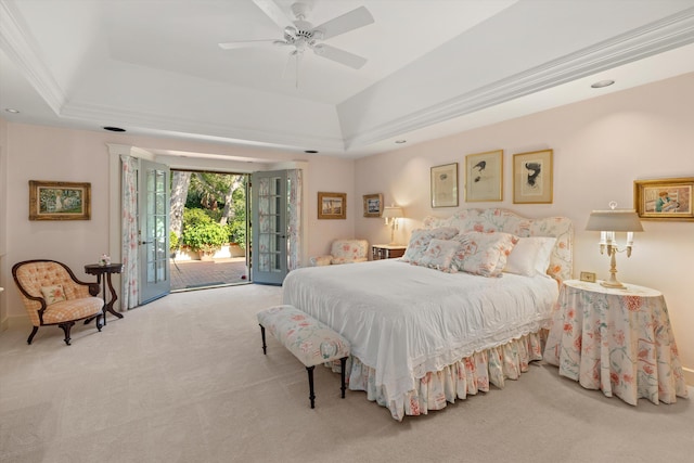 carpeted bedroom with crown molding, french doors, access to outside, ceiling fan, and a raised ceiling