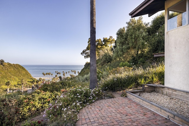 view of patio / terrace featuring a water view