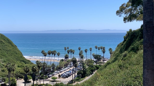 water view with a mountain view and a beach view