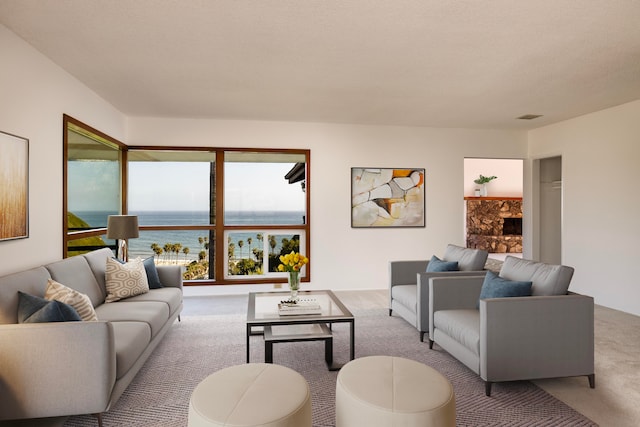 living room featuring a water view and light carpet