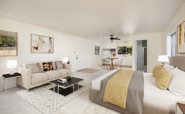 carpeted living room with ceiling fan