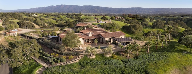 drone / aerial view featuring a mountain view