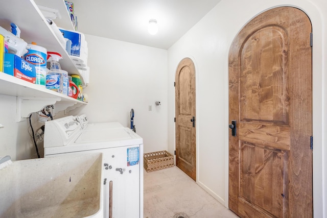 laundry area featuring sink and washer and dryer