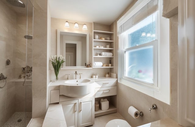 5415 Campbell Rd, Lompoc, CA 93436 - bathroom featuring a shower stall, vanity, built in shelves, and toilet