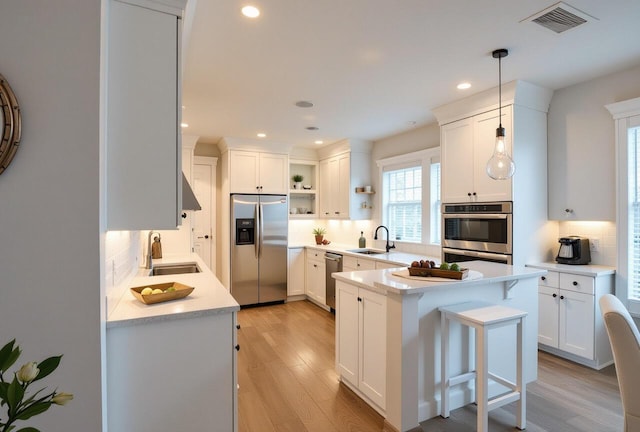 5415 Campbell Rd, Lompoc, CA 93436 - kitchen featuring stainless steel appliances, open shelves, tasteful backsplash, a sink, and recessed lighting
