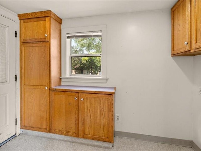 interior space featuring baseboards