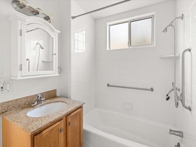 bathroom with shower / bath combination and vanity