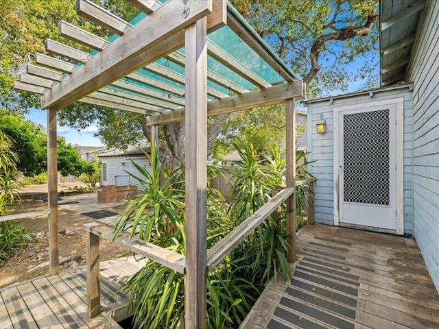 view of patio / terrace with a wooden deck and a pergola