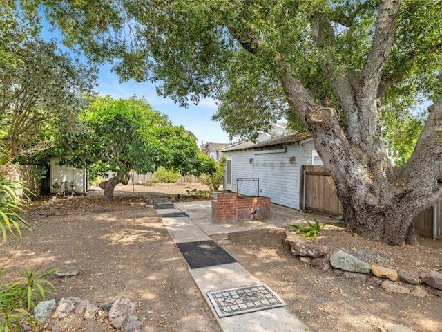 view of yard with a patio area and fence