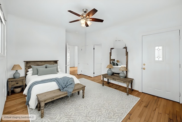 bedroom with light wood-type flooring and ceiling fan