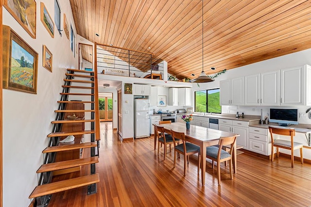 dining area featuring high vaulted ceiling, wood ceiling, and hardwood / wood-style flooring