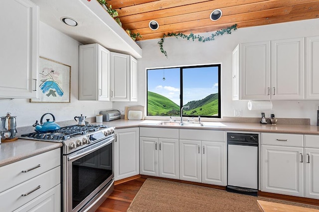 kitchen featuring white cabinets, stainless steel gas range, sink, wooden ceiling, and light hardwood / wood-style flooring