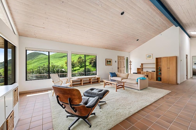 tiled living room featuring high vaulted ceiling and beamed ceiling