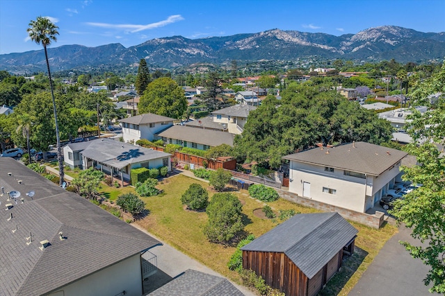 birds eye view of property featuring a mountain view