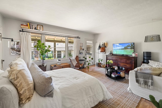 bedroom with light hardwood / wood-style floors