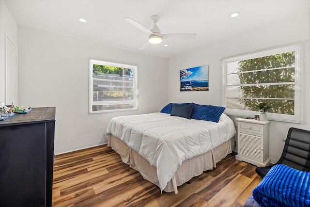 bedroom with wood-type flooring and ceiling fan