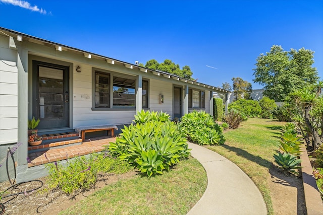 exterior space with a yard