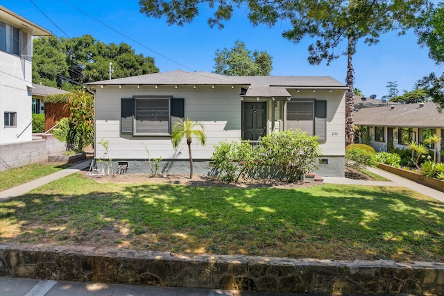 bungalow with a front yard