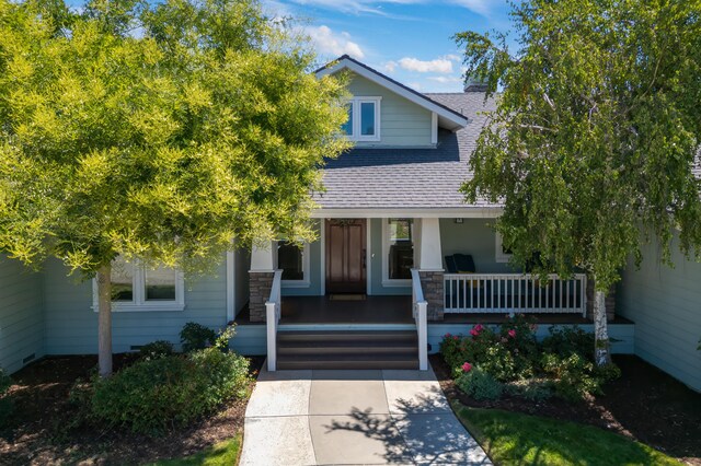 obstructed view of property with a porch