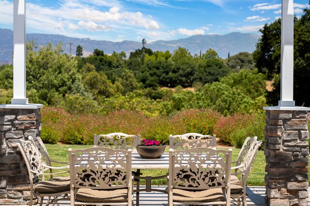 view of patio / terrace featuring a mountain view