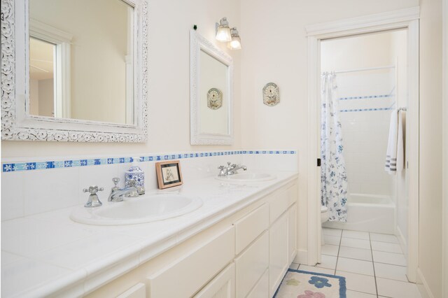 full bathroom with tile patterned floors, toilet, shower / bath combo, and double sink vanity