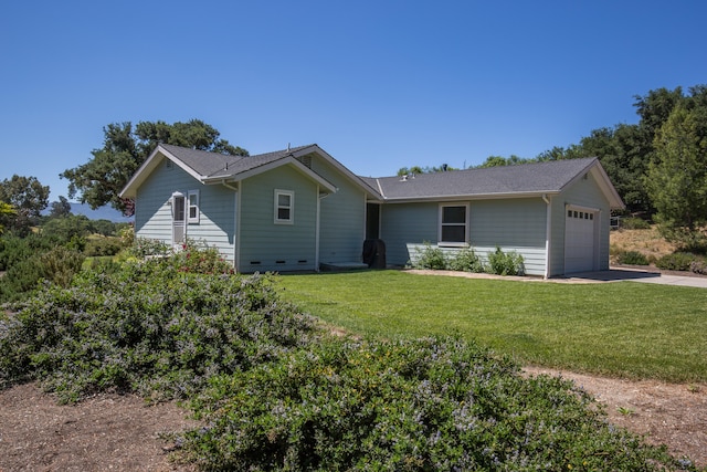 ranch-style home featuring a garage and a front lawn