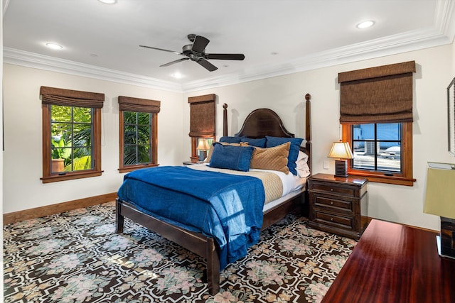 carpeted bedroom featuring ornamental molding and ceiling fan