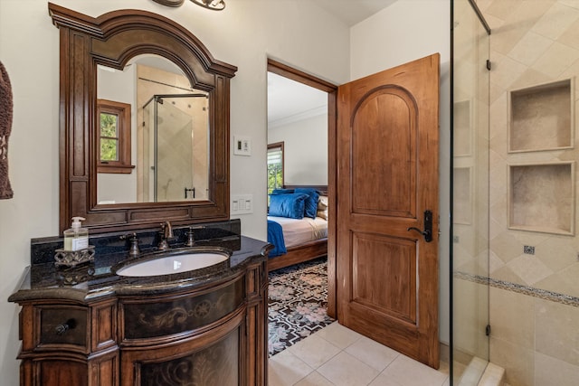 bathroom with tile patterned flooring, crown molding, an enclosed shower, and vanity