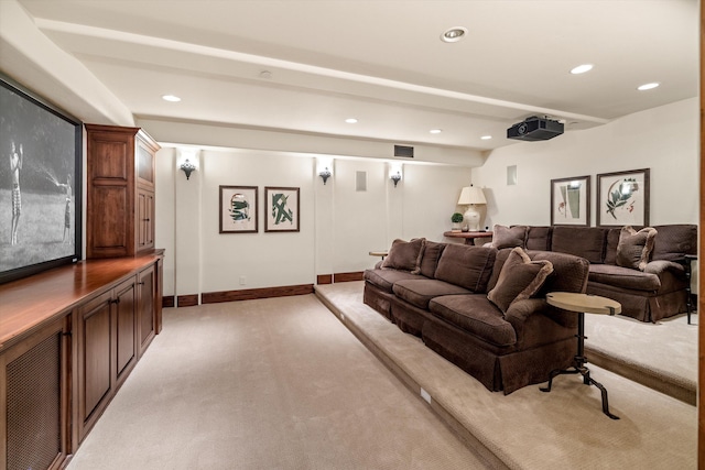 cinema featuring beam ceiling and light carpet