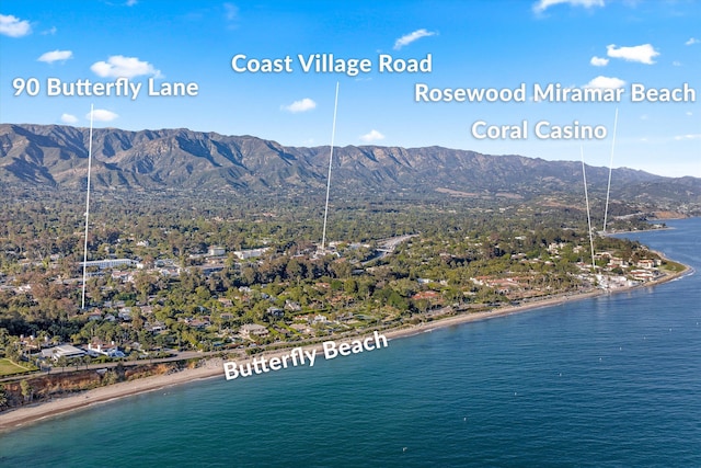 aerial view featuring a water and mountain view