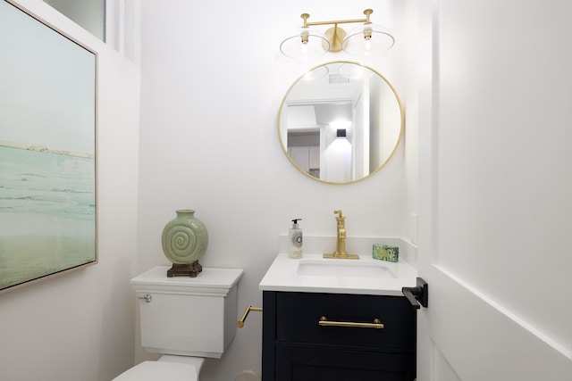 bathroom with vanity and toilet