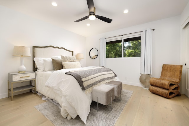 bedroom with ceiling fan and light wood-type flooring