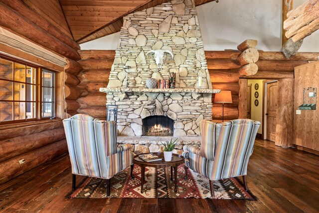 living room with hardwood / wood-style floors, a fireplace, log walls, and wood ceiling