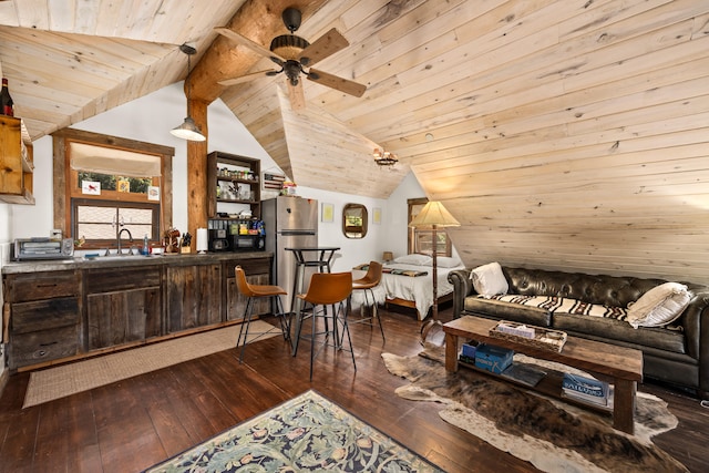 living room featuring dark hardwood / wood-style flooring, lofted ceiling, ceiling fan, sink, and wood ceiling