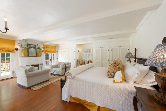 1259 Alamo Pintado Rd, Solvang, CA 93463 - bedroom featuring wood finished floors, beamed ceiling, access to outside, ornamental molding, and two closets