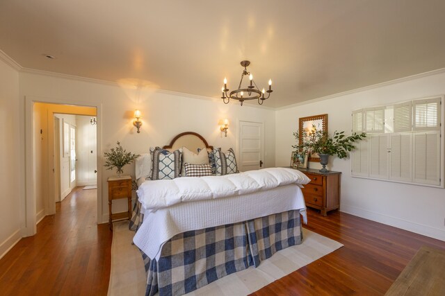 1259 Alamo Pintado Rd, Solvang, CA 93463 - bedroom with wood finished floors, crown molding, baseboards, and a chandelier