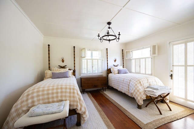 1259 Alamo Pintado Rd, Solvang, CA 93463 - bedroom with multiple windows, a chandelier, wood finished floors, and ornamental molding