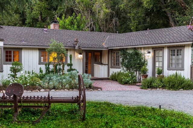1259 Alamo Pintado Rd, Solvang, CA 93463 - ranch-style home featuring a chimney, board and batten siding, and roof with shingles
