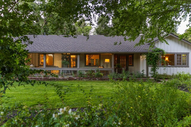 1259 Alamo Pintado Rd, Solvang, CA 93463 - single story home featuring a front lawn, covered porch, and board and batten siding