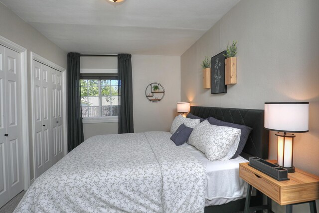 bedroom with two closets