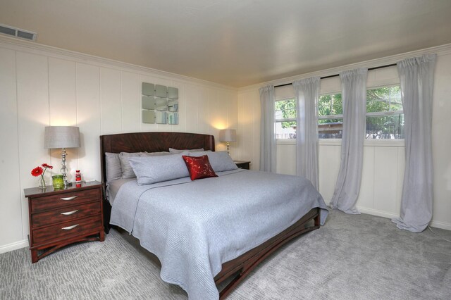 bedroom with light colored carpet