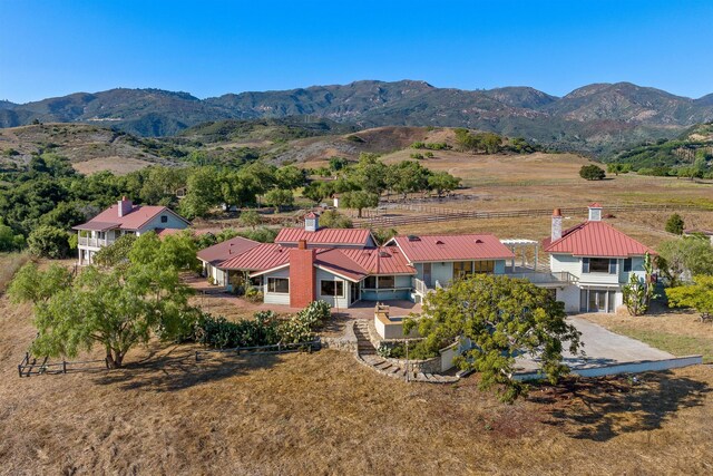 bird's eye view featuring a mountain view and a rural view