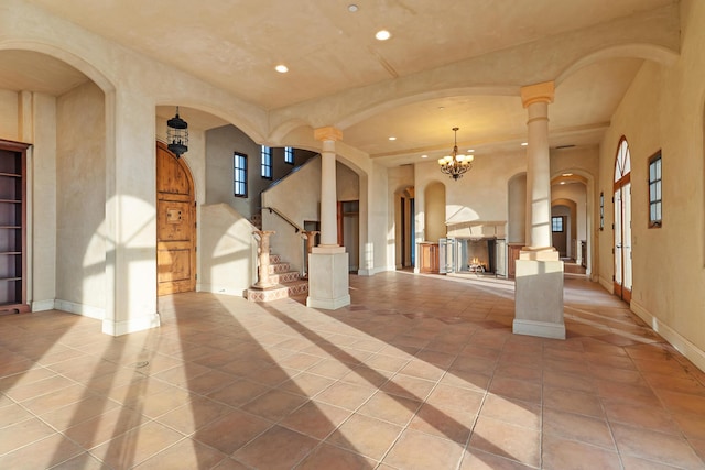 interior space with plenty of natural light, baseboards, tile patterned flooring, stairs, and recessed lighting