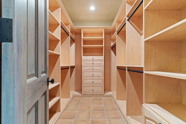 walk in closet with tile patterned flooring