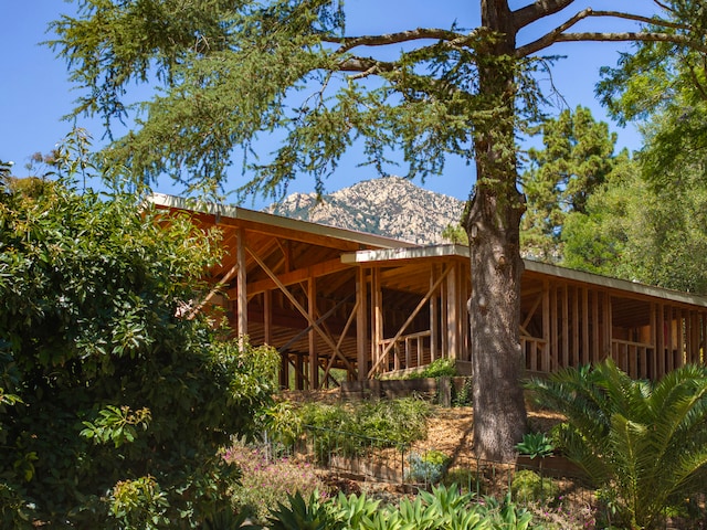 back of property with a mountain view