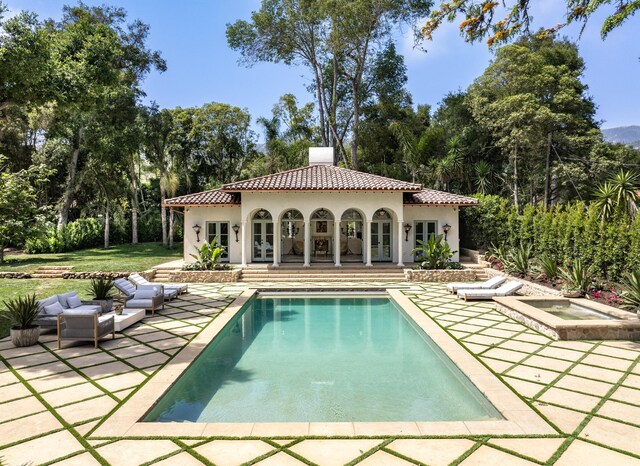 view of swimming pool with outdoor lounge area and a patio area