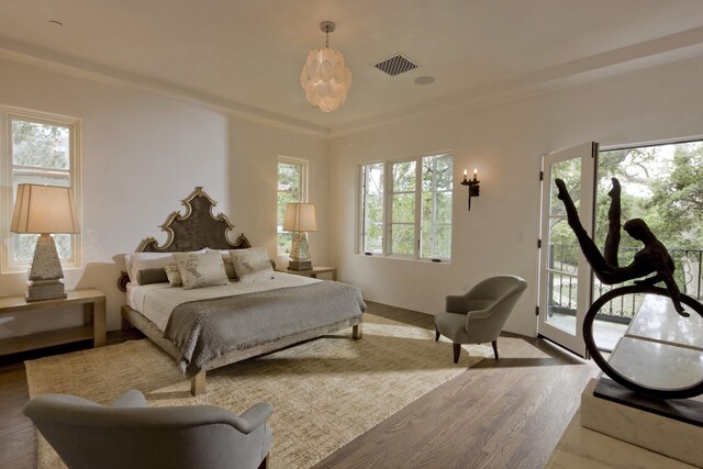 bedroom featuring access to outside and hardwood / wood-style floors