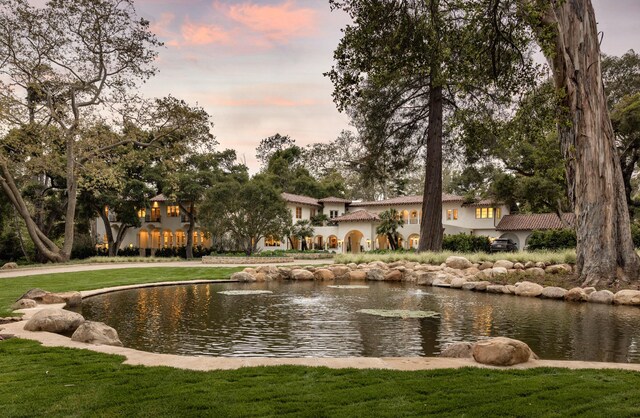 view of home's community with a lawn